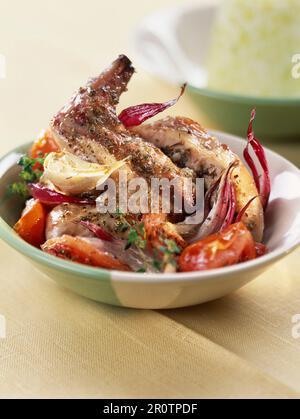 Oven roasted rabbit leg Stock Photo - Alamy