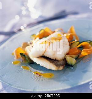 John Dory fillet with vegetable tagliatelles and citrus fruit and saffron coulis Stock Photo