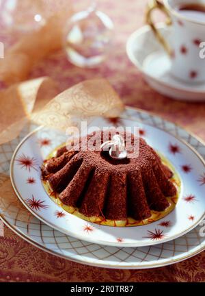 moist chocolate cake with saffron sauce Stock Photo