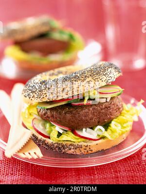 hamburger in poppy seed bagel Stock Photo