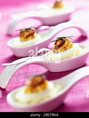 Mimosa hard-boiled eggs with whelk paste and anchovies Stock Photo