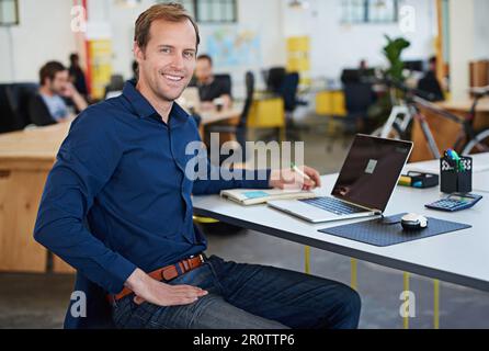 Developing tomorrows tech today. a designer at their workstation in an office. Stock Photo