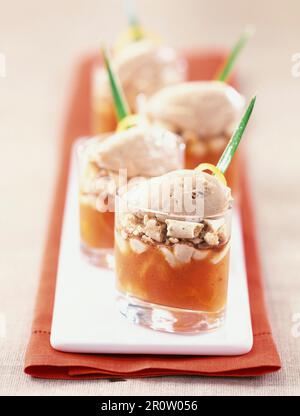 Verrines of macaroon,coffee ice cream and mango jelly Stock Photo