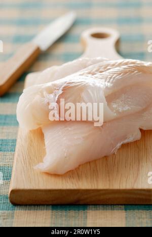 Raw cod fillets Stock Photo - Alamy