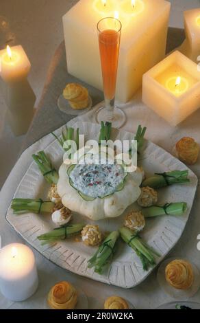 Pumpkin filled with cervelle de canut cream cheese on a table laid for Christmas dinner Stock Photo