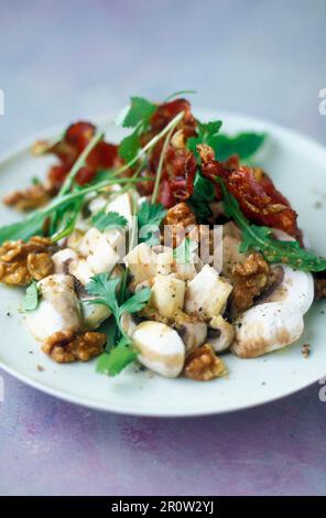 Steamed vegetables with walnuts and bacon Stock Photo