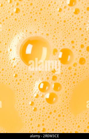 Close-up of beaten egg yolks with bubbles Stock Photo