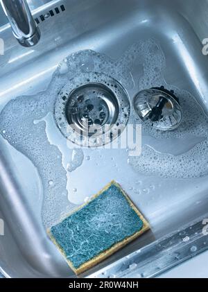 Sponge in the sink Stock Photo