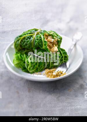 Small cabbages stuffed with tofu and quinoa Stock Photo