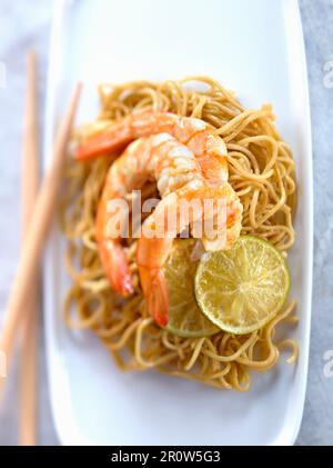 Shrimps with yuzu and ginger,sauteed noodles Stock Photo