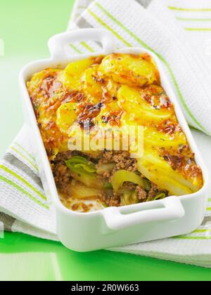 Leek,potato and minced beef cheese-topped dish Stock Photo