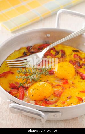 Baked eggs with tuna Stock Photo