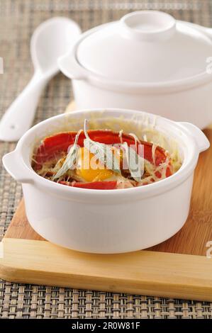 Coddled egg with bacon and cheese Stock Photo
