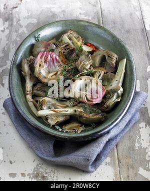 Grilled artichokes with thyme and garlic Stock Photo
