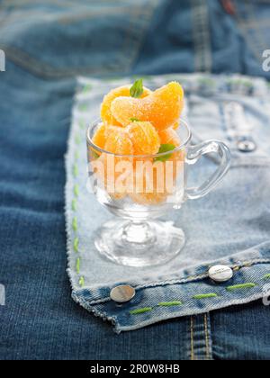 Frosted tangerine segments with basil Stock Photo