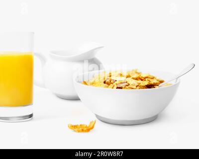 Bowl of cereals and glass of orange juice Stock Photo