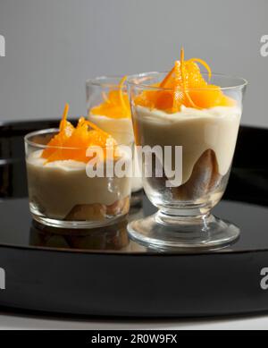 Finger biscuit and orange zabaglione dessert Stock Photo