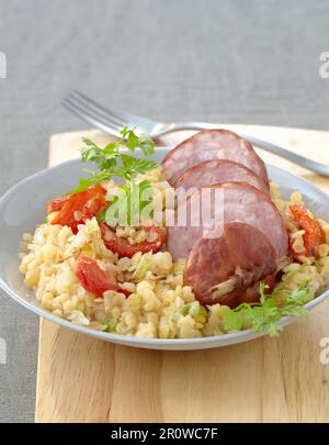 Morteau sausage with orange lentils Stock Photo