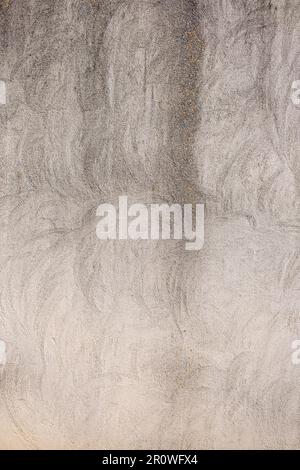 detail of the texture of a weathered wall with white cement covering Stock Photo
