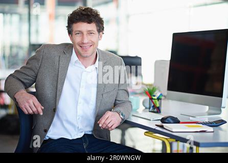 Developing tomorrows tech today. a designer at their workstation in an office. Stock Photo