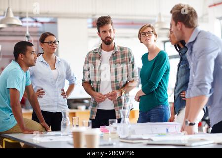 Coming up with creative solutions. a group of young designers having a brainstorming meeting. Stock Photo