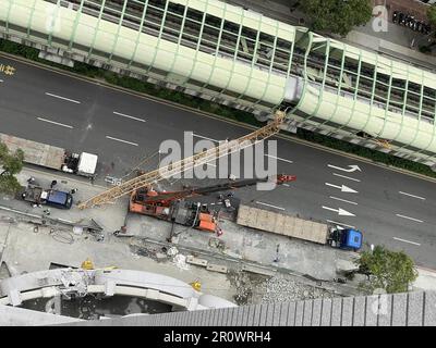 Taichung, Taichung, Taiwan. 10th May, 2023. In this handout photo provided by Taichung City Fire Department, damages on the metro overpass and the crane are seen at the site of accident. According to Taichung City authorities, at least 8 people including a foreign national have been injured and one person has died after a crane hit a moving metro with passengers on board at around 12 noon local time. Credit: ZUMA Press, Inc./Alamy Live News Stock Photo