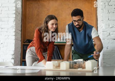 Young couple working as architects in the office. Stock Photo