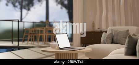 Side view of a laptop computer white screen mockup on a minimal wooden coffee table in cozy contemporary living room. 3d render, 3d illustration Stock Photo