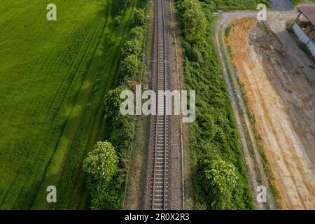 Flying over railway tracks, top view. Railway track tracks line railroad train rail aerial photo panoramic view travel Stock Photo
