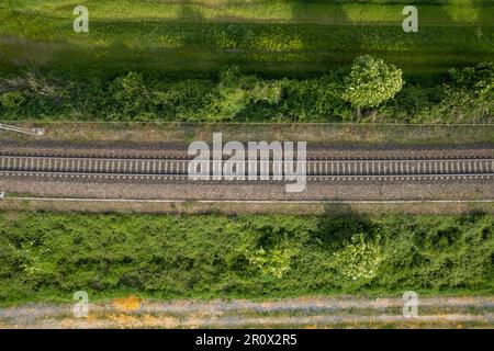 Flying over railway tracks, top view. Railway track tracks line railroad train rail aerial photo panoramic view travel Stock Photo