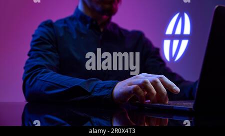 Businessman working on laptop, using internet services. Holographic, digital icon of web. Innovations and networking system Stock Photo
