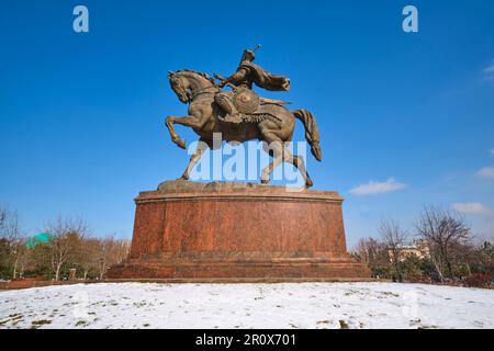 View of the large, horse and leader statue in the middle of Amir Temur Square park. Right after a winter storm left a light , white dusting of fresh s Stock Photo