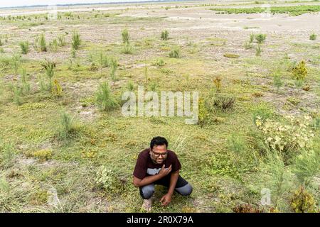 man having a heart attack and sitting on the land. healthcare concept Stock Photo