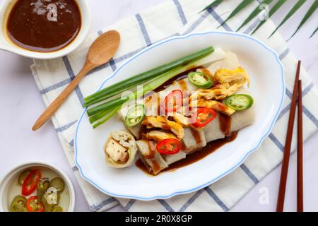 Thai style spring roll at top view with sauce  - Thai-Chinese appetizer called Por Pia Sod Stock Photo