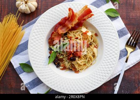 Spaghetti with bacon and dried chili at top view - Spaghetti Aglio E Olio Stock Photo
