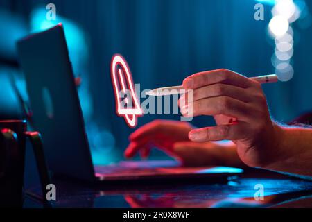 Businessman working on laptop. Digital, holographic icon of notification. Programming Stock Photo