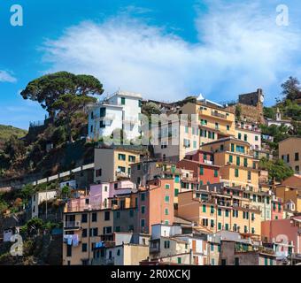 Beautiful summer Manarola view from excursion ship. One of five famous villages of Cinque Terre National Park in Liguria, Italy, suspended between Lig Stock Photo