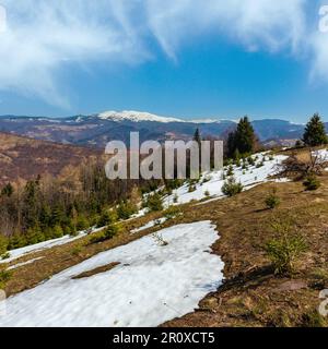 Early spring Carpathian mountains plateau landscape with snow-covered ridge tops in far, Ukraine. Stock Photo