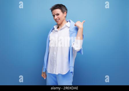 authentic young trendy dark haired woman in a cool look Stock Photo