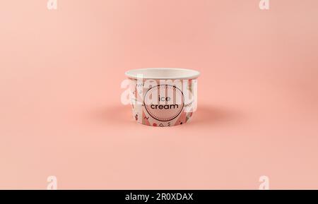 Ice cream cup on pink background. One empty ice cream cup. Copy space. Stock Photo