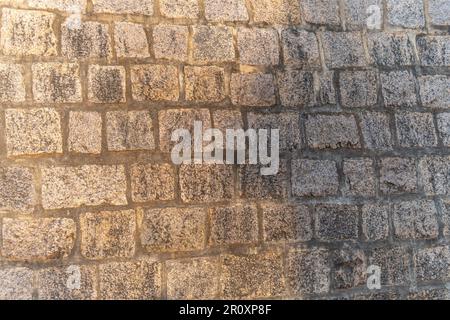 The brick wall in Mahabalipuram is a portion of a bigger architectural complex that also includes numerous historic temples and monuments. Stock Photo