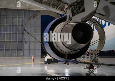 Airplane repairing in the hangar. Aircraft engine on the wing. Stock Photo