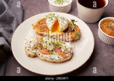Sandwiches with zucchini spread and greek yogurt, egg, salmon close up. FODMAP, KETO, low in calories, diet, superfood concept. Stock Photo