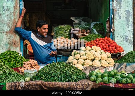 Vegetable seller ih his shop in Sadar Market. Jodhpur, Rajasthan, India Stock Photo