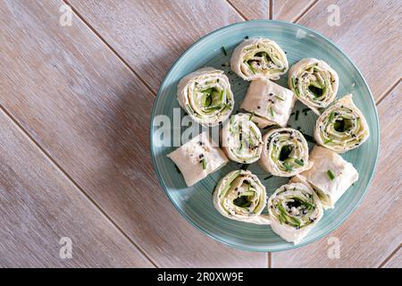 Cream cheese dill cucumber tortilla wrap Stock Photo