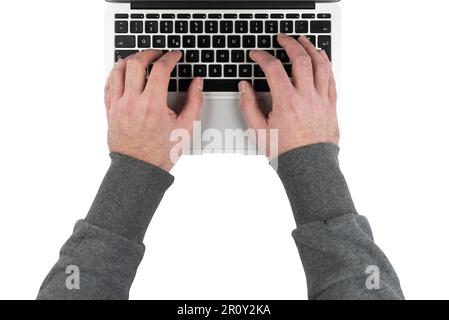 top down view of hands of man typing on laptop computer isolated on white Stock Photo