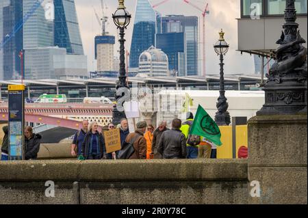 LONDON - April 21, 2023: Activists of Extinction Rebellion take to the streets to protest climate change outside Sea Containers London. Stock Photo