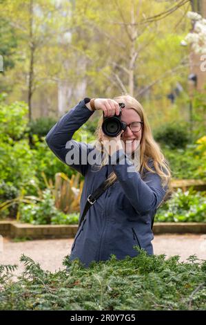 Follow the journey of a talented and passionate female photographer as she captures the world around her through her lens, inspiring creativity and em Stock Photo