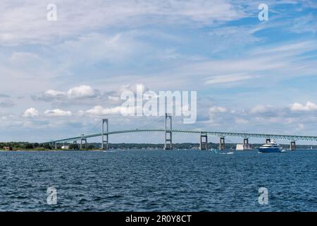 View over the water of Mount Hope Bay towards two-lane suspension Mount Hope Bridge in Rhode Island, USA connecting Portsmouth and Bristol Stock Photo