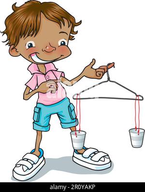 Young Indian / mixed-race boy holding a coat hanger balance scale, simple homemade balance for testing, weighing, measuring, comparing maths problems. Stock Photo